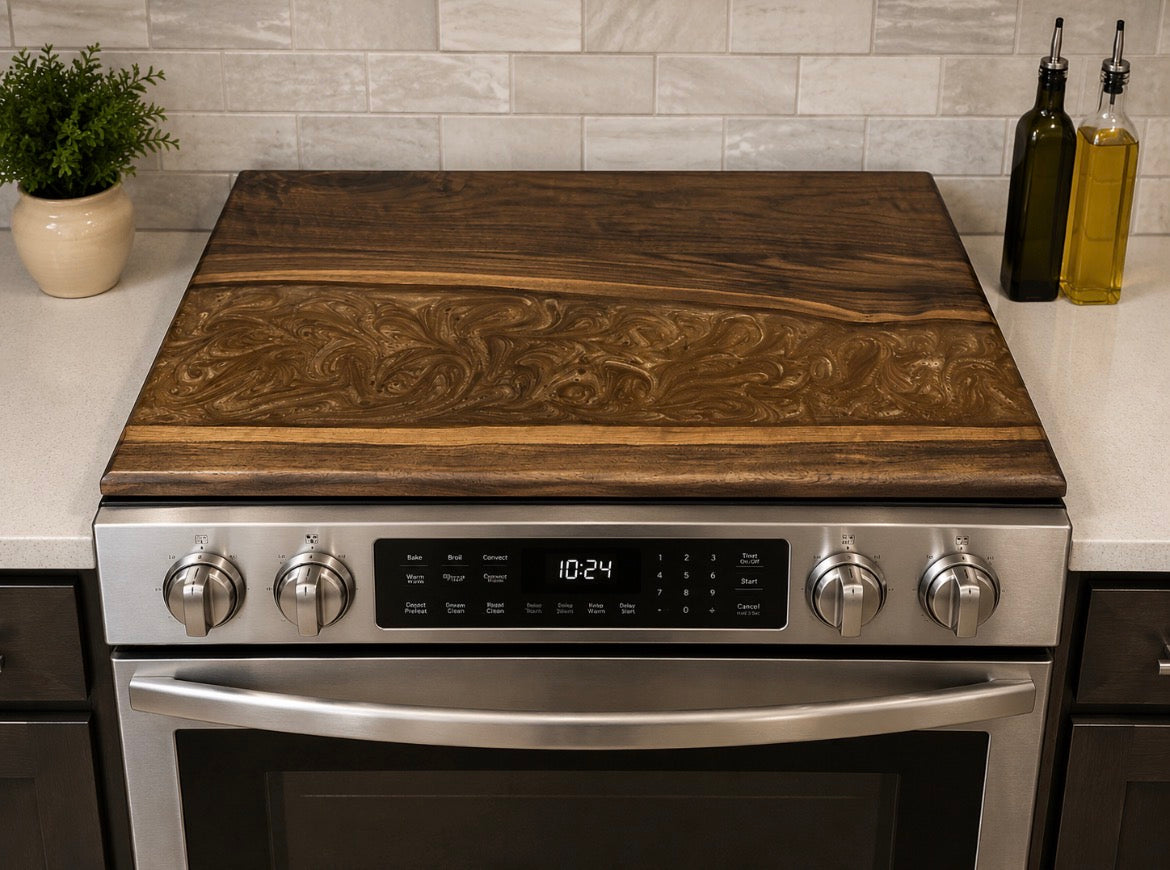 Hand-carved floral walnut noodle board on a stainless range