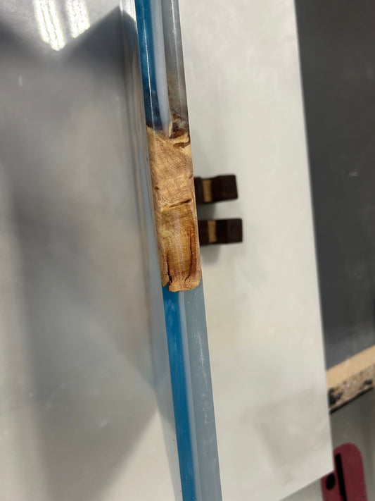 Side view of the magnetic knife holder showing the burl wood edge and walnut foot