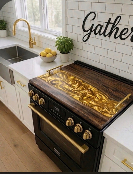 Walnut noodle board with gold epoxy river on a black and gold range