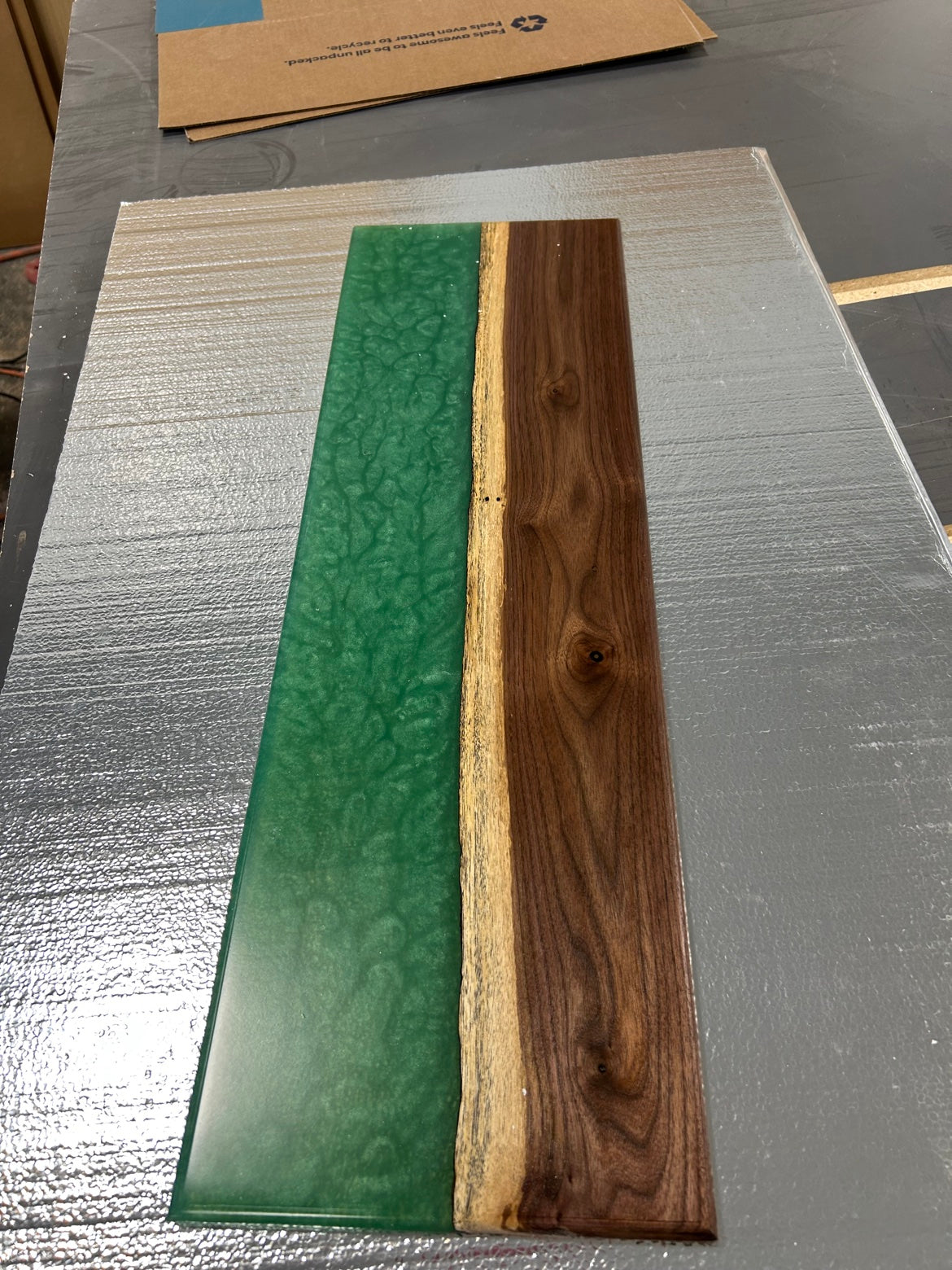 Walnut bath caddy with emerald green epoxy river, angled view