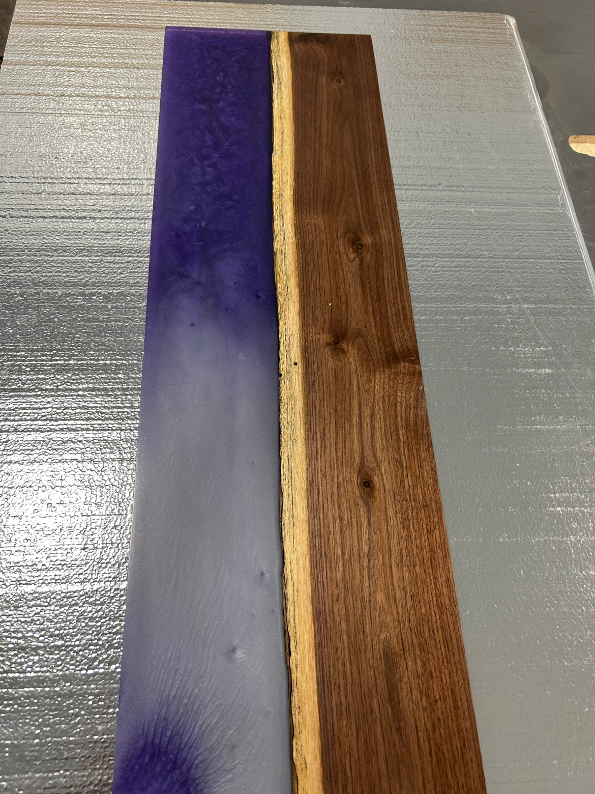 Walnut bath caddy with purple epoxy river, angled view